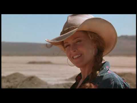 Trailer frame: heat shimmer over the dry lake bed; the score and songs trade off