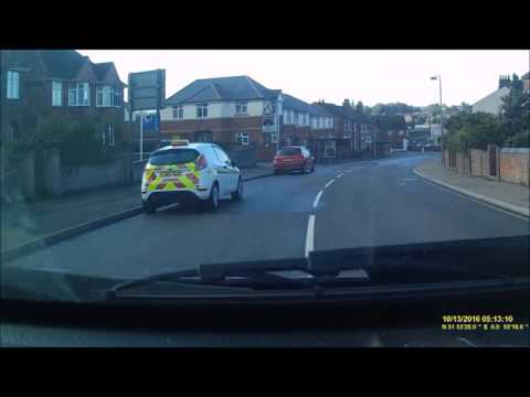 Car driving the wrong way through a level crossing.