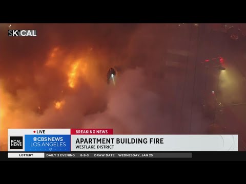 Firefighters amid blaze burning through Westlake apartment complex