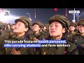 North Koreans Don Hazmat Suits For Anniversary Parade
