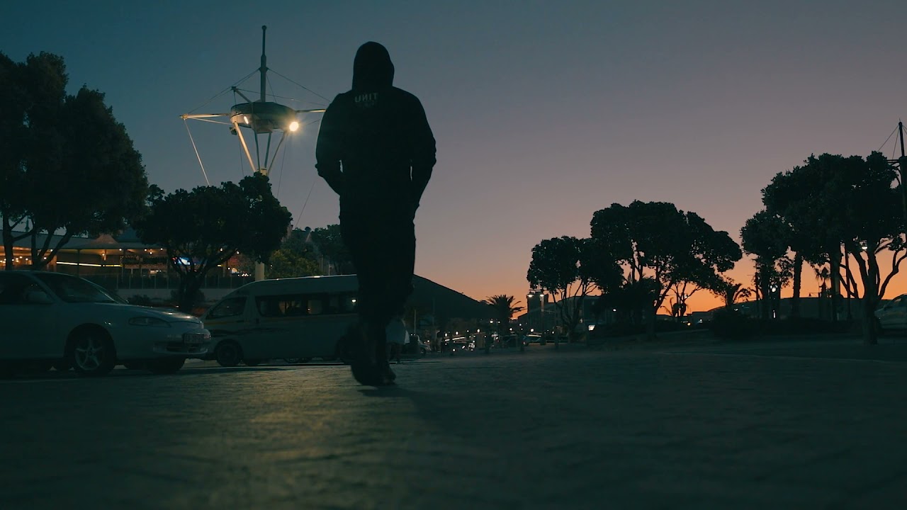 Man walking in street and sunset - Copyright Free Video