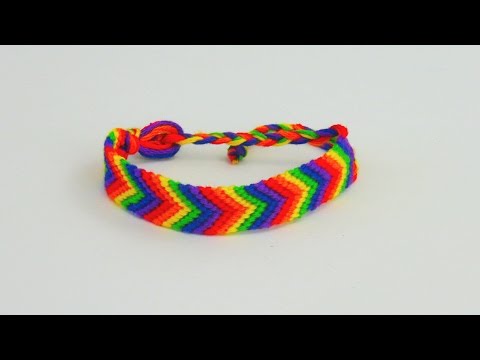 Knotting a bracelet / friendship bracelet with a rainbow pattern Cotton bracelet with an arrow pa...