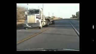 Big truck passing on double yellow straight at cop