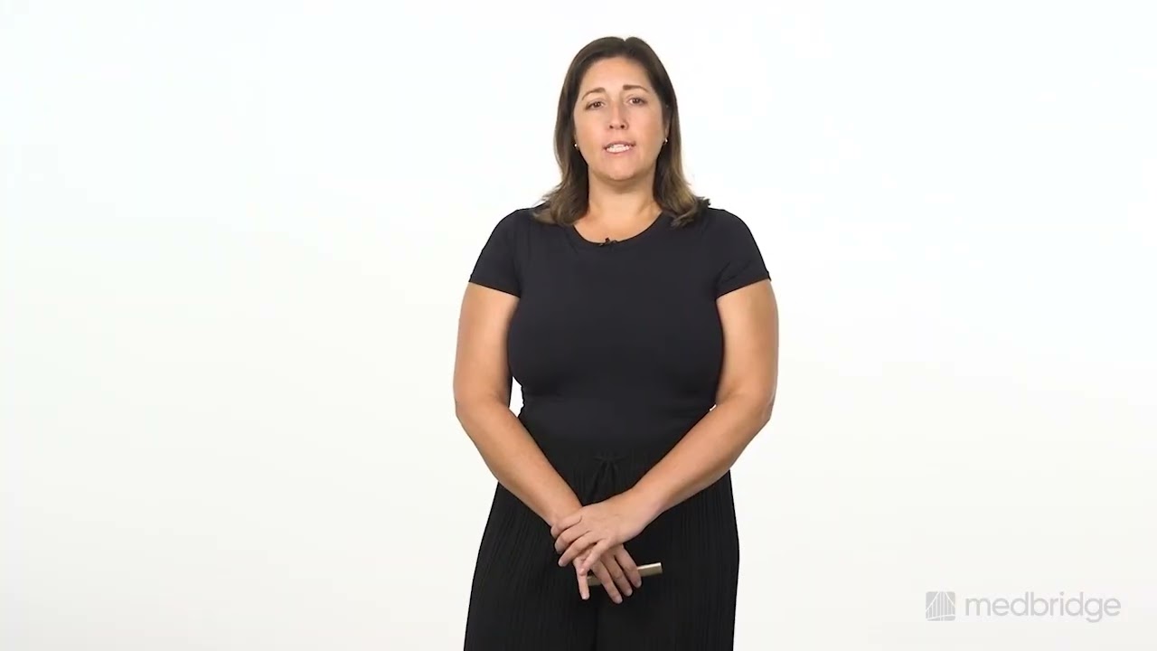 Woman in black clothes holds a pen against a white background, prepared to discuss medbridge digital healthcare.