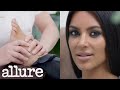 Kim Kardashian Gets a Foot Massage While Answering Questions | Allure