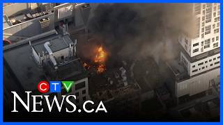 Download lagu Chopper video captures a big explosion from a rooftop fire in downtown Toronto mp3