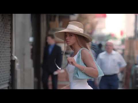 Trailer frame cutting from Paris pomp to pop-leaning action beats, echoing the score-to-pop handoff in the film