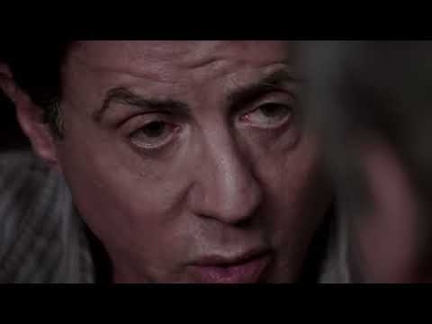 Escape Plan 2013 trailer frame of Stallone and Schwarzenegger in the glass cell