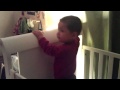 Sebastian Playing In Crib