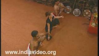 Exercising Kalaripayattu trio