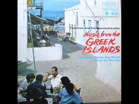 Tacticos and his Bouzoukis play music from the Greek Islands.      Rowing Boat by the Shore.