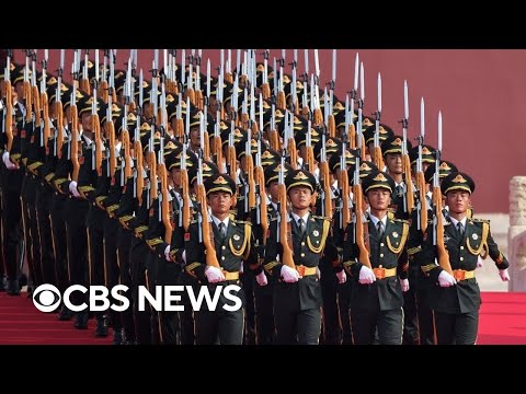 Who attended China's massive military parade?