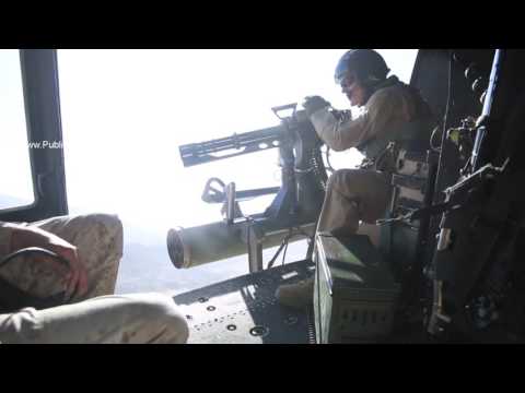 UH-1Y Huey Marine Crew Chief fires GAU-17/A minigun from archival footage