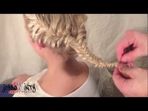 Person demonstrating the Glimmer Fish Braid hairstyle, featuring a detailed fishtail braid technique suitable for events and inspired by The Hunger Games.