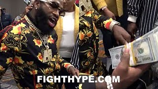 ADRIEN BRONER PEACOCKING, FLOSSIN, AND PUTS JEWELER ON FRONT STREET IN FRONT OF FANS