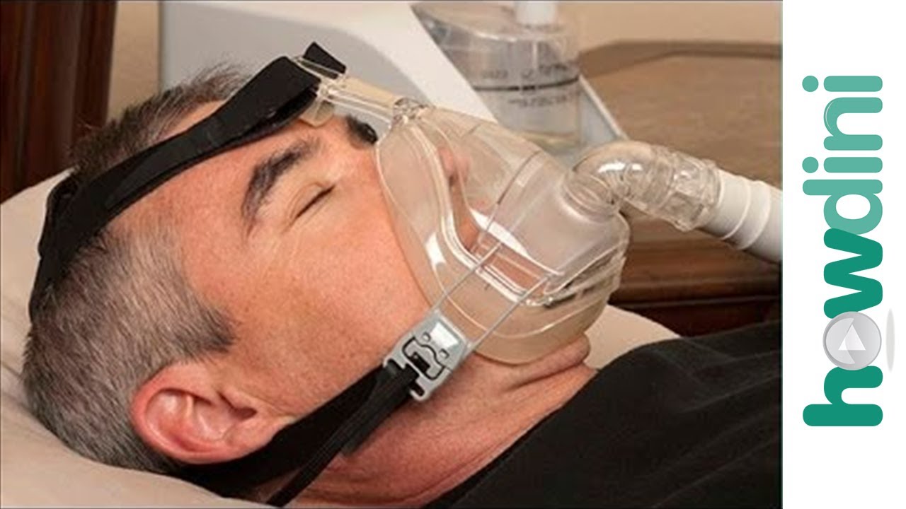 Patient laying on back wearing a breathing machine