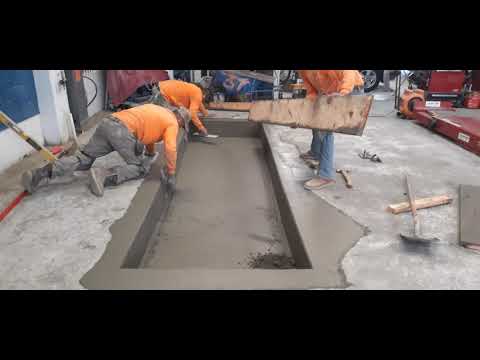 Veterans concrete,...strip forms/ begin finish car lift pit