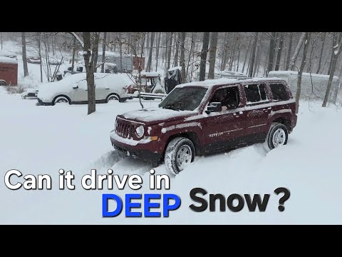 Jeep patriot VS Ford Explorer Police in deep snow.