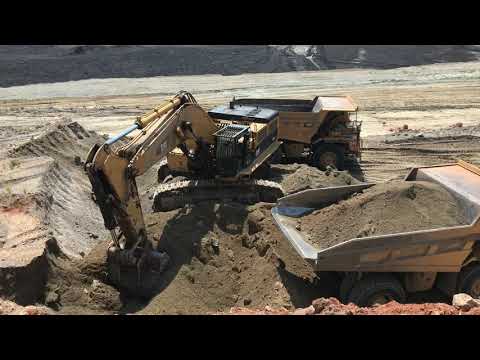 Caterpillar 385C Excavator Loading Caterpillar Dumpers