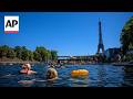 Paris residents swim in the Seine in the shadow of the Eiffel Tower