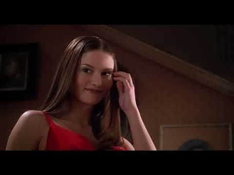 Trailer still — airport curb at dusk, headlights and a last-chance sprint