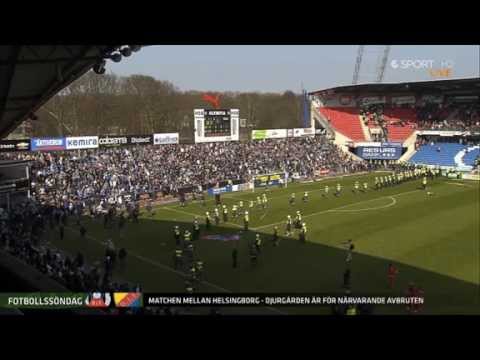 Supporters entering the field during a football game in Sweden's highest division