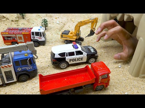 Police car rescue construction vehicles from the hand in the cave