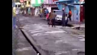 ST LUCIAN GUY BEGS ANOTHER TO FLY HIS HAND BOTH HAS CUTLASS