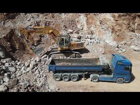 Drone View: Liebherr 974 Excavator Loading Trucks At Aggregate Quarry - Sotiriadis/Labrianidis