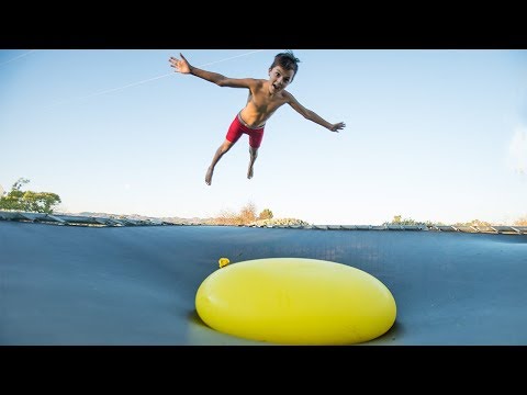 JUMPING ONTO A GAINT 6FT WATER BALLOON!!