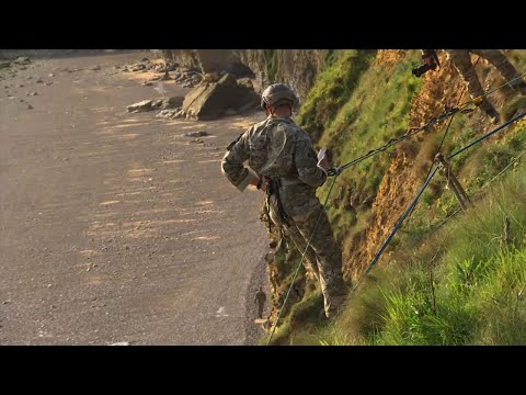 American veterans watched US rangers re-enact an event from World War II during which Allied forces scaled cliffs above a Normandy beach to silence Nazi guns. The event was part of commemorations for the 75th anniversary of the D-Day invasion. (June 5)
