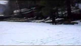 preview picture of video 'Dirt bike pulling guy across frozen lake'