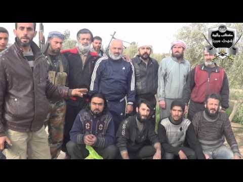 بعض السجناء الذي تم تحريرهم من السجن المركزي في محافظة الرقة من قبل كتائب وألوية شهداء سوريا