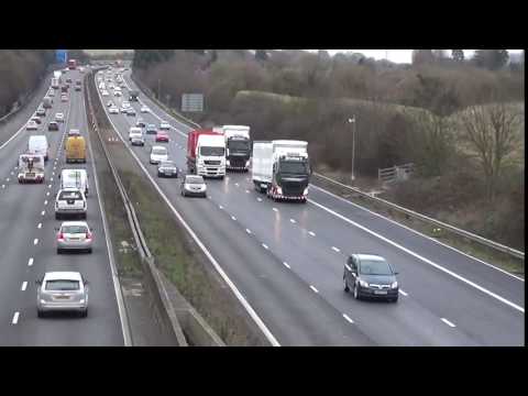 EDDIE STOBARTS H4508,H4699 WITH F1 RACE TRAILERS IN CONVOY ON M5,GLOUCESTER 080317