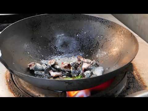 Taiwanese street food stir fry frogs in a pan