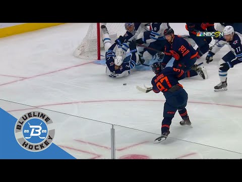 Dylan DeMelo puts his hands up as he's falling back and blocks the shot of Connor McDavid