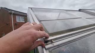 How to stop a polycarbonate  greenhouse window from blowing out
