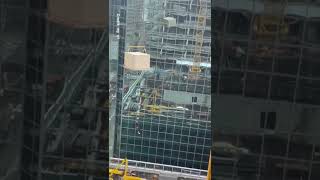 WATCH: Man dangling from construction crane
