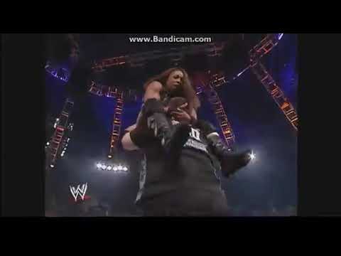 Bubba Ray Dudley powerbombs Jazz through table