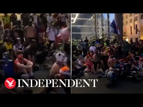 Hundreds of people who identify as dogs bark at each other in Berlin train station