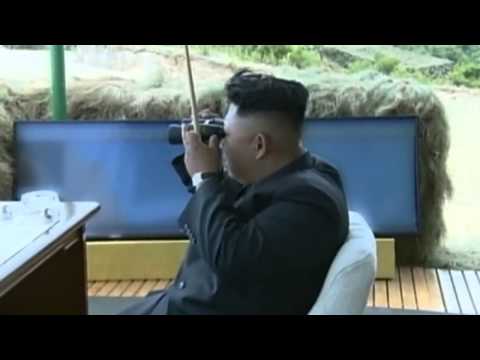North Korea  Kim Jong Un smiling as he watches military exercises