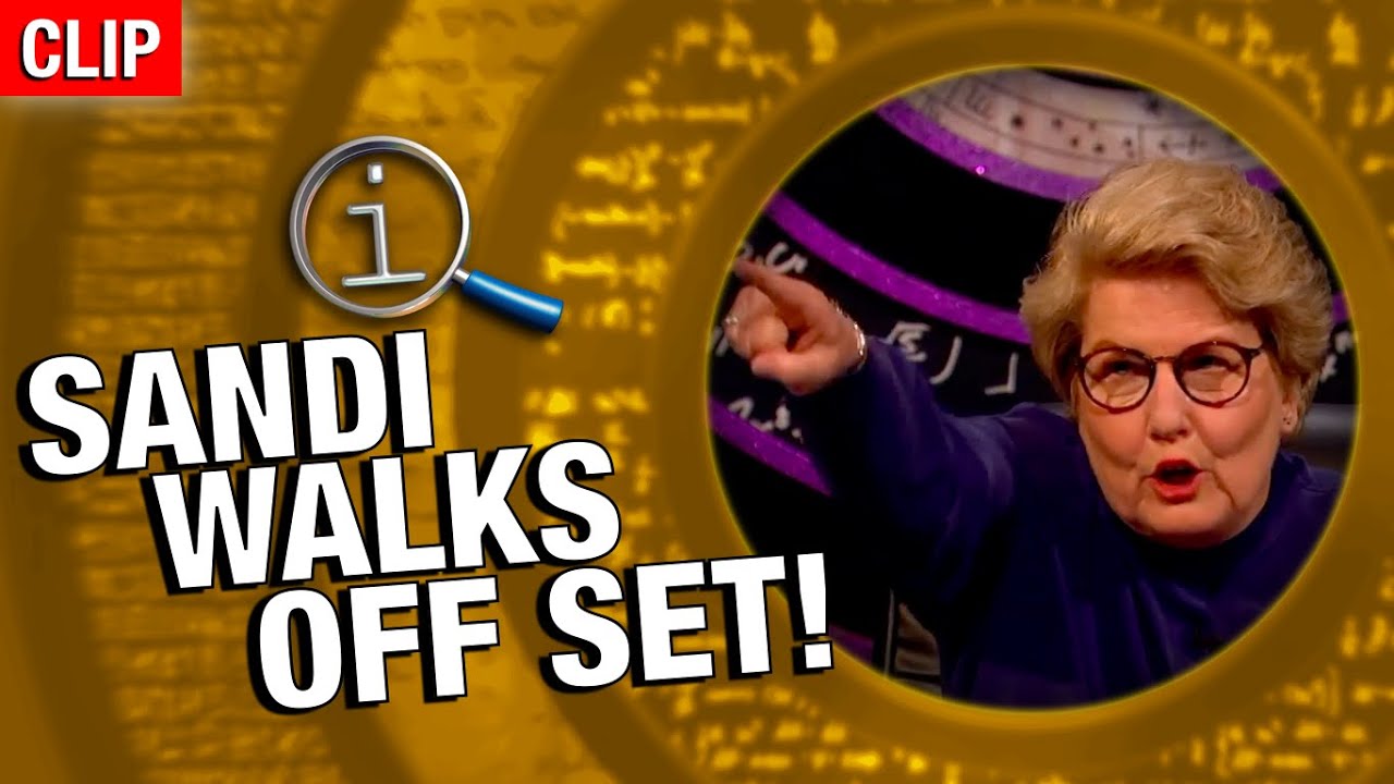 QI | Sandi Walks Off Set!