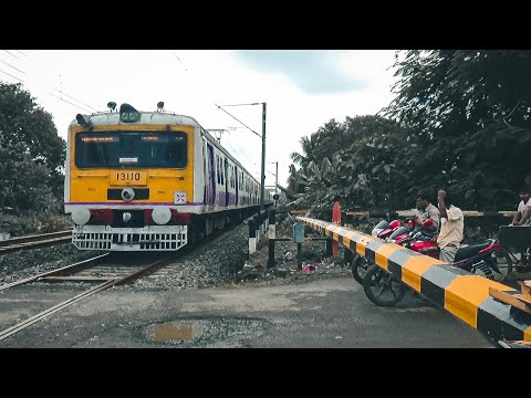 High speed passenger trains furiously skipping through crowded level crossing