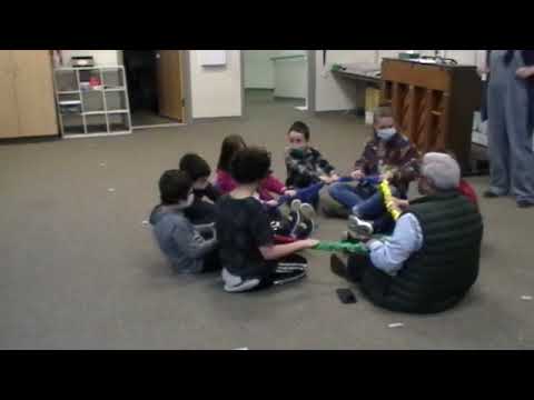 Mrs. Visser's class sings the "Stretchy Band Song."