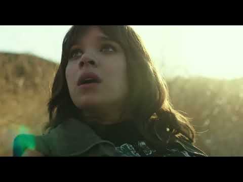 Trailer composition: Bee protects Charlie as sparks and debris rain, orchestral pulse rising