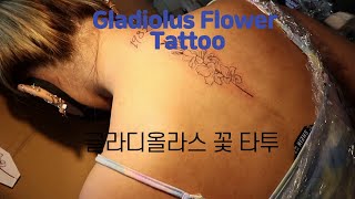 #Gladiolus Flower Tattoo With 1982#Gladiolus Flowers#Gladiolus#Flower Tattoo#Back Tattoo
