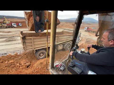 Caterpillar 245 Excavator Loading Mercedes And MAN Trucks