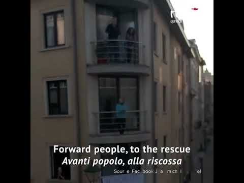 This woman went on her balcony with an accordeon to perform the Italian song "Bandiera Rossa"