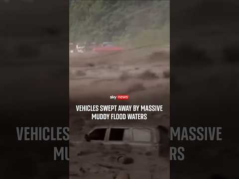 Vehicles swept away by massive muddy flood waters