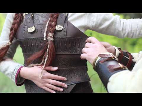 Arming a Viking lady for the battle. "Shieldmaiden" leather armor
